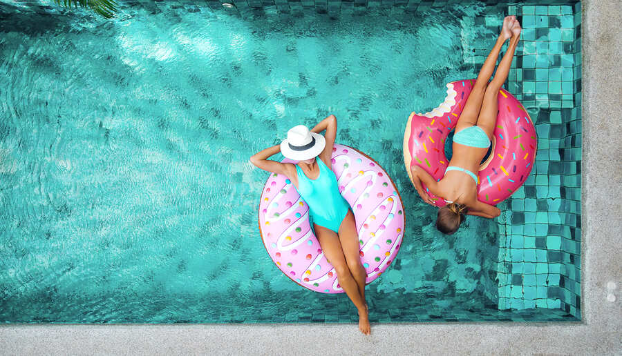 ladies are chilling in the pool