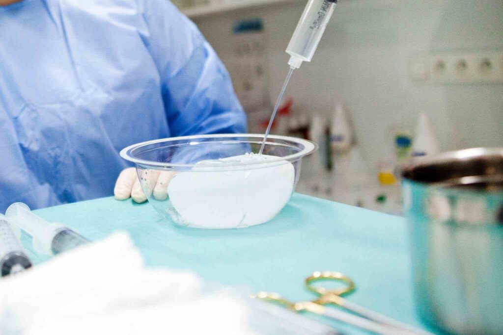 breast augmentation surgery in the operating room surgeon tools implant