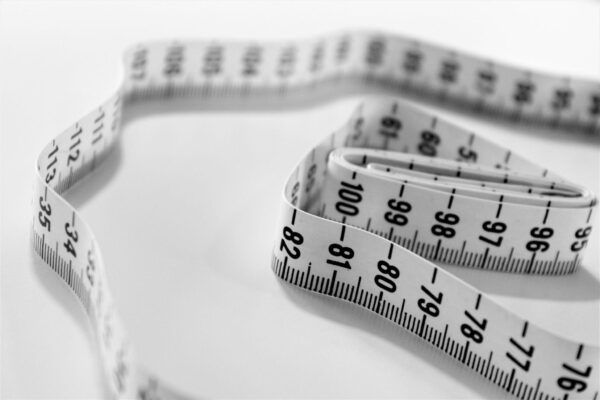 measuring tape on white table